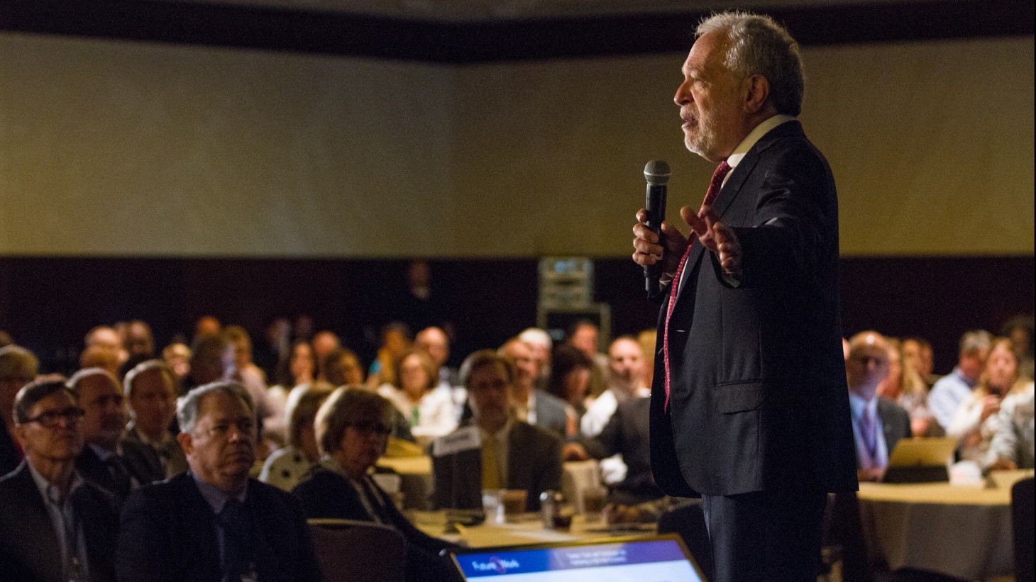 Robert Reich speaking at a conference 