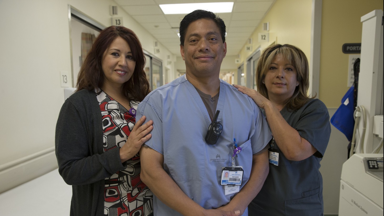 three health care workers posing together 