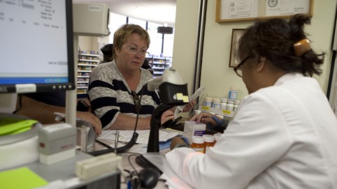 Pharmacy tech speaks with patient.